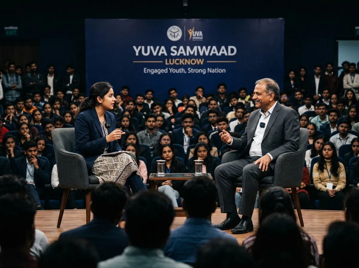 The Yuva Samwaad stage: a moderator and a guest in conversation before a branded backdrop.